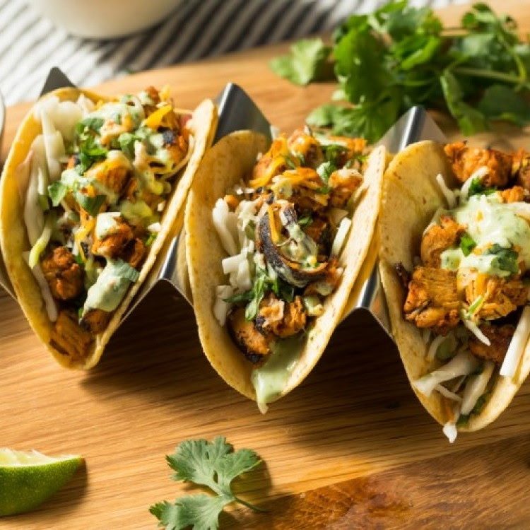 Plated tacos with house sauce